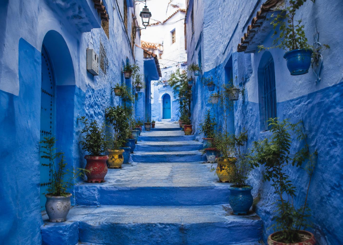 A blue-painted stairway alley in the Chefchaouen medina